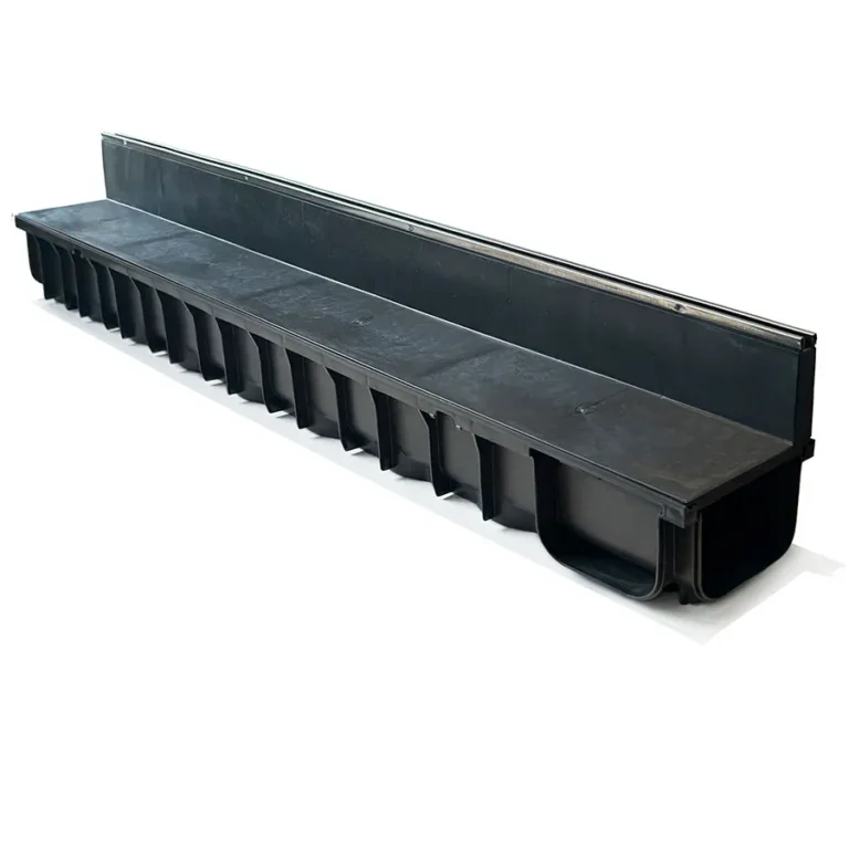 The DekDrain Vela Edge Drainage Channel x 1m 87mm Upstand features a black plastic body and grated cover, providing efficient outdoor water runoff management.