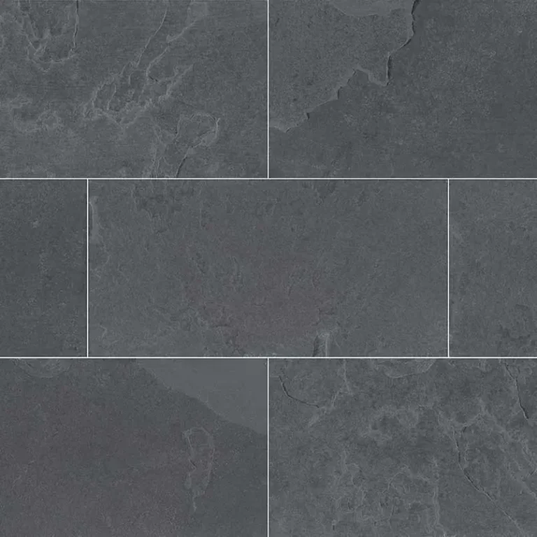 Close-up of a Brazilian Black Slate wall with a subtle textured surface. Each rectangular tile, reminiscent of cobble setts, is neatly aligned, showcasing natural stone patterns and variations in shades, creating a modern and sophisticated look.